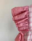 Vestido vichy rosa com tapa fraldas