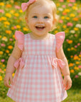 Vestido vichy rosa com tapa fraldas